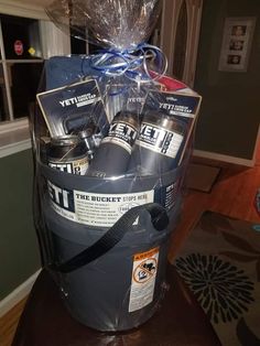 the bucket is full of beer and wrapped in plastic