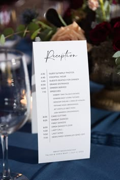 a table setting with wine glasses and menus