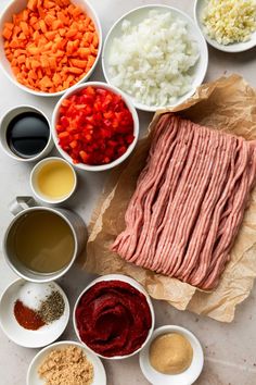 the ingredients for this dish are laid out in bowls