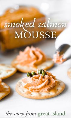 the cover of smoked salmon mousse is shown with crackers and sauces