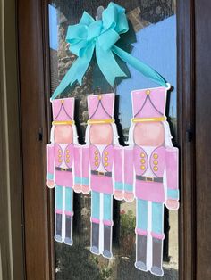 an image of a door decorated with paper soldiers and a blue bow on the front