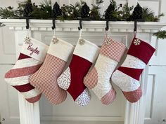 christmas stockings hanging from a fireplace mantel