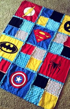 a quilt made to look like superheros on the floor with text that reads make a quilt from tee shirts