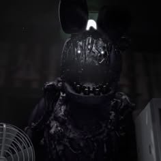 a creepy mickey mouse in a dark room