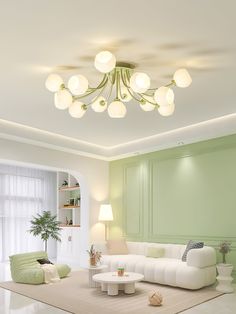 a living room with green walls and white furniture