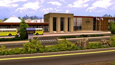 a yellow school bus parked in front of a building with flags on it's roof