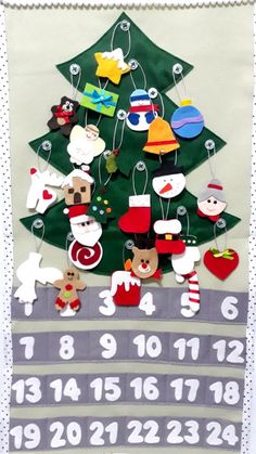 a christmas tree with ornaments hanging from it's sides and numbers on the side