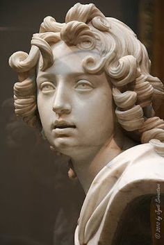 a close up of a statue of a woman's head