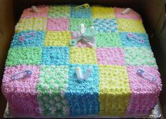 a cake in the shape of a checkerboard pattern is sitting on top of a cardboard box