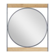 a round mirror mounted on a wooden frame