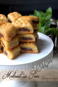 a white plate topped with cookies on top of a table