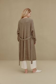 Knitted Coat Chic Long Cashmere Cardigan, Long Knitted Outerwear For Layering, Brown Cashmere Long Sleeve Sweater Coat, Long Sleeve Cashmere Sweater Coat In Beige, Beige Cashmere Long Sleeve Sweater Coat, Beige Cashmere Sweater Coat For Spring, Winter Workwear Sweater With Soft Texture, Beige Long Sleeve Cashmere Sweater Coat, Oversized Knit Sweater Coat For Workwear