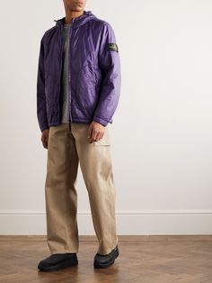 Stone Island has been at the forefront of fabric innovation since its founding in 1982. A case in point, this jacket is densely woven from military spec shell and treated with the label's 'invisible soft touch' for added durability. It's padded with exclusive PrimaLoft® insulation and easily packable – it can be folded to fit in its own internal pocket. Stone Island Outfit, Shadow Outfit, Island Outfit, Purple Coat, Purple Logo, Jacket For Men, Shell Jacket, Stone Island, Mr Porter