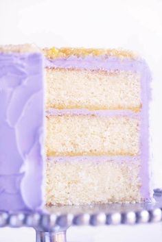 a close up of a slice of cake on a metal stand with beads around it