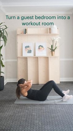 a woman is doing an exercise on a yoga mat in front of a bookcase