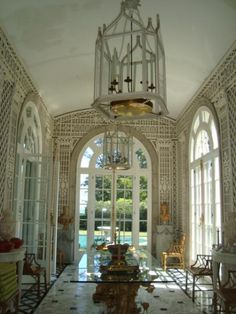 the inside of a house with an ornate chandelier hanging from it's ceiling