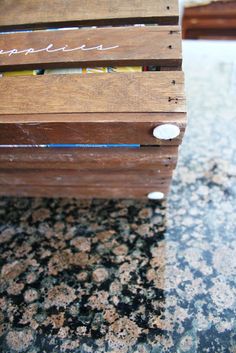 a wooden bench sitting on top of a granite counter