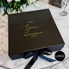 a black box with the words to my green on our wedding day written on it