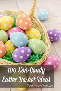 a basket filled with colorful easter eggs on top of a wooden floor