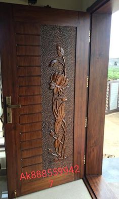 a wooden door with decorative carvings on it