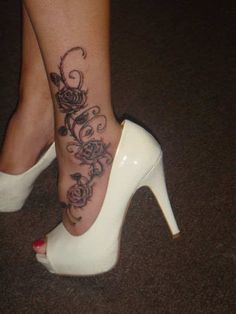 a woman's foot with a tattoo on it