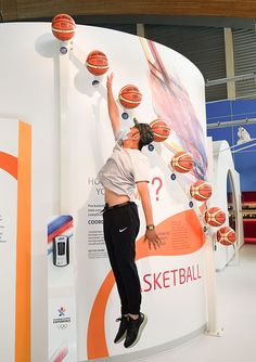 a man is jumping up in the air with basketballs on his head and feet