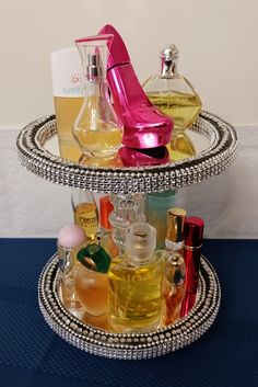 two tiered tray with perfume bottles on it