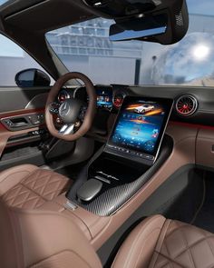 the interior of a car with dashboard, steering wheel and touch screen display on it