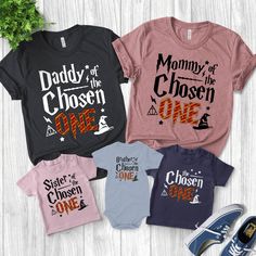 three shirts with the words daddy of chosen one, mommy of chosen one and dad of chosen