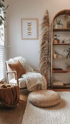 a living room filled with furniture and plants