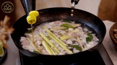 a pan filled with food on top of a stove