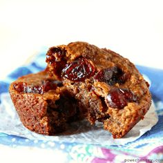 two muffins cut in half sitting on top of a blue and white plate