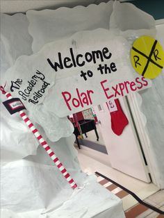 a polar express welcome sign is posted on the door