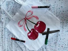 cherries with bows tote bag ♡ Tote Bag Painting Ideas Coquette, Painting Tote Bags Ideas, Tote Bag Ideas Paint, Summer Tote Bag Design, Drawing On Tote Bag, Tote Bag Inspo Paint, Aesthetic Tote Bag Painting, Paint Tote Bag Ideas, Tote Bag Drawing Ideas