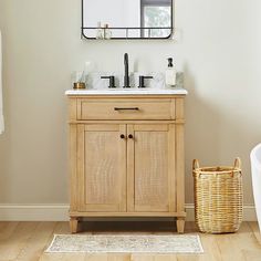 a bathroom with a sink, mirror and bathtub in the corner next to a rug