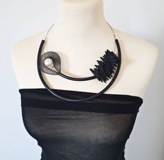 Fabulous statement necklace, made of black plastic tube, black foam triangles, black nylon mesh and white pearl bead. Very lightweight. A must have accessory to jazz up your wardrobe. Length : 55 cm Package will be shipped out as soon as I possibly can which is usually 3 - 5 business days after the purchase. Don't hesitate to contact me if you have any question. Thanks for stopping by and don't forget to check my other items. Join Pevalek Jewellery at https://www.facebook.com/PevalekJewellery Asymmetrical Jewelry, Popular Necklaces, Unusual Necklace, Mesh Necklace, Modern Necklace, Bib Necklaces, Modern Necklaces, Necklace Statement, Bib Necklace