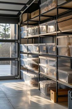 the storage room is filled with lots of clear plastic containers and bins for various items