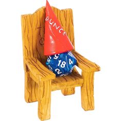 a wooden chair with a blue and red dice sitting on it's back legs