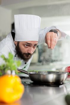 a man in a chef's hat is preparing food