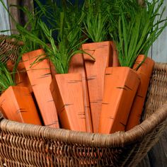 some carrots are in a wicker basket