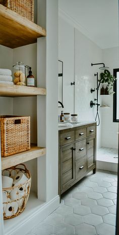 the bathroom is clean and ready to be used as a storage area for toiletries