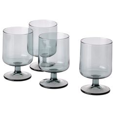 four clear glass cups sitting on top of each other