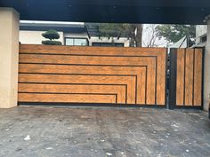 a car parked in front of a wooden gate