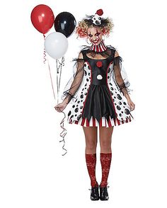 a woman dressed as a clown holding balloons