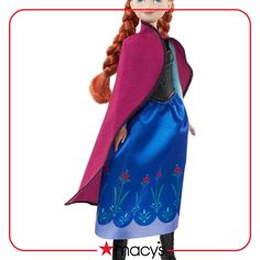 the doll is wearing a blue and pink dress