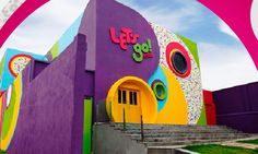 a colorful building with stairs leading up to it