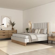 a bedroom with a bed, dresser and mirror on the wall next to each other