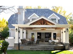 a house with a covered patio and dining area