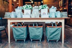 several bags are sitting on top of a table