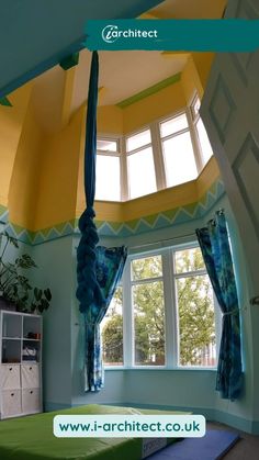 a bed sitting under a window in a bedroom